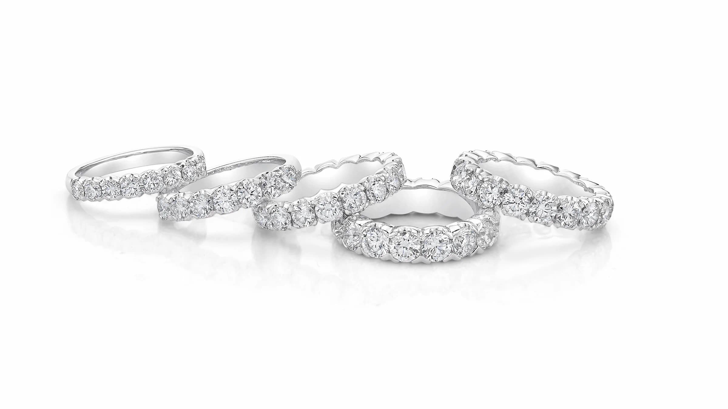 Selection of Ryder Diamonds engagement rings on neutral background